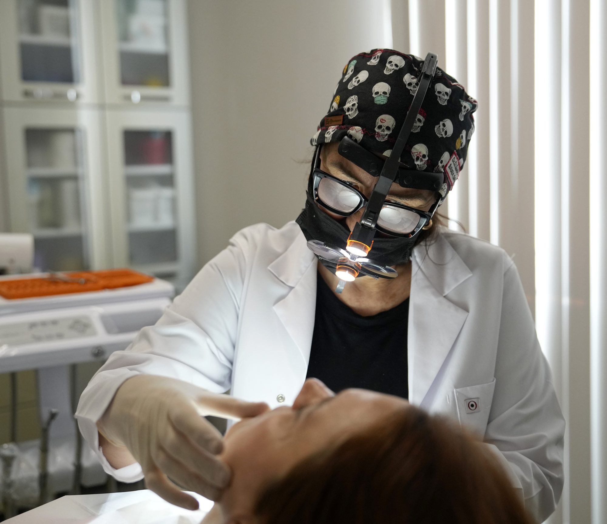 Dr. Devrim Sipahi treating a patient, dental clinic Şişli Istanbul